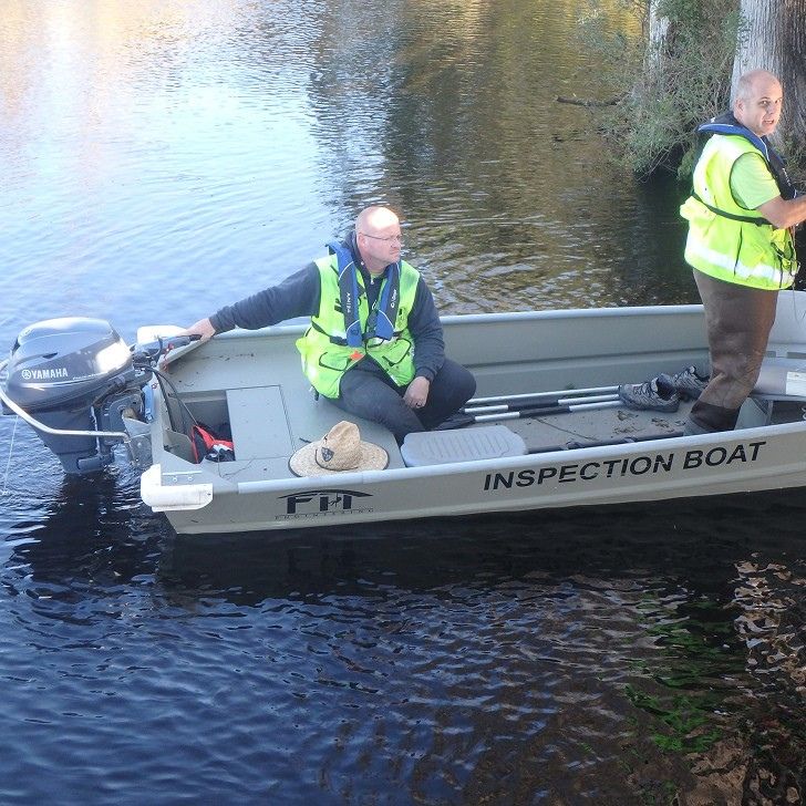 Two FIT Engineering inspectors in an inspection boat.